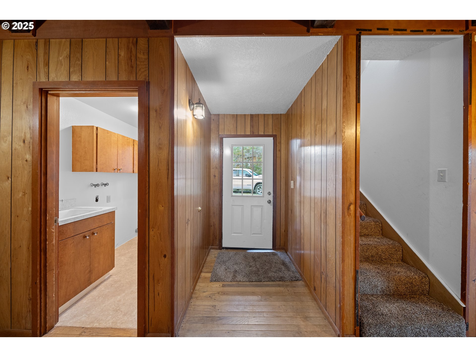 604 Thorton Oar Lane Reedsport, OR 97467 - Photo 4 of 47 a view of a hallway with wooden floor and entryway