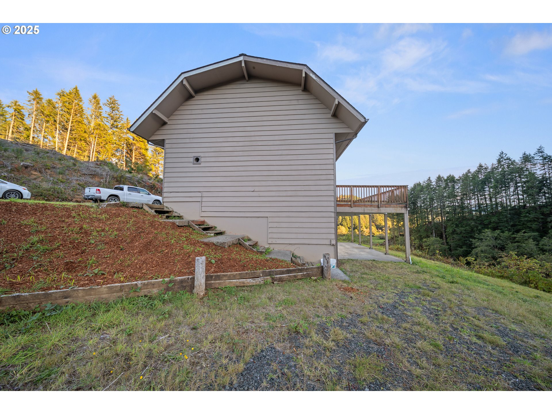 604 Thorton Oar Lane Reedsport, OR 97467 - Photo 41 of 47 a backyard of a house with lots of green space