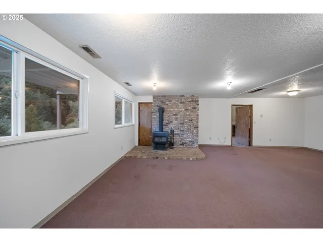a kitchen with a sink cabinets and window