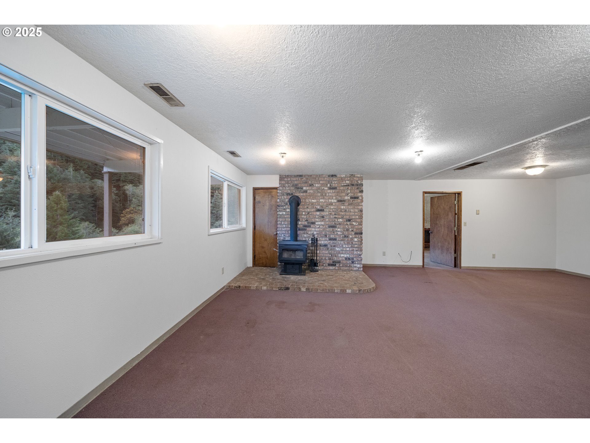 604 Thorton Oar Lane Reedsport, OR 97467 - Photo 8 of 47 a view of an empty room with a window
