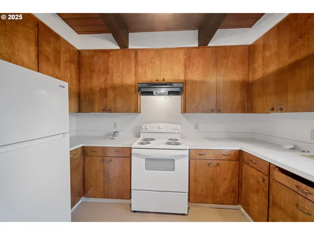 a kitchen with a sink and a window