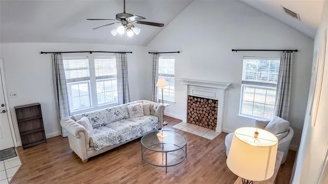 a living room with furniture and a fireplace