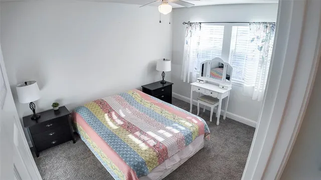 a bathroom with a toilet and shower curtain