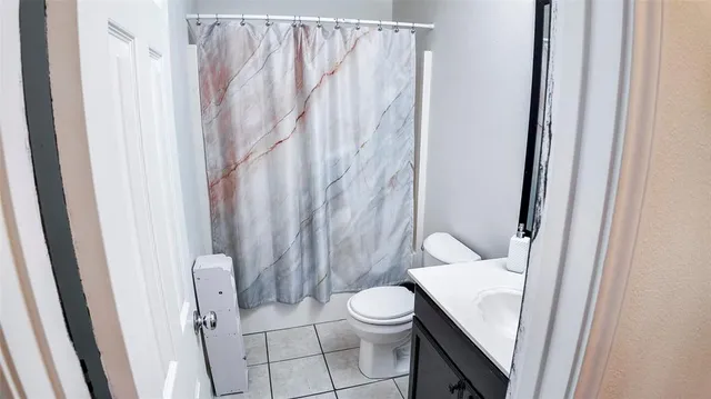 a bathroom with a granite countertop window
