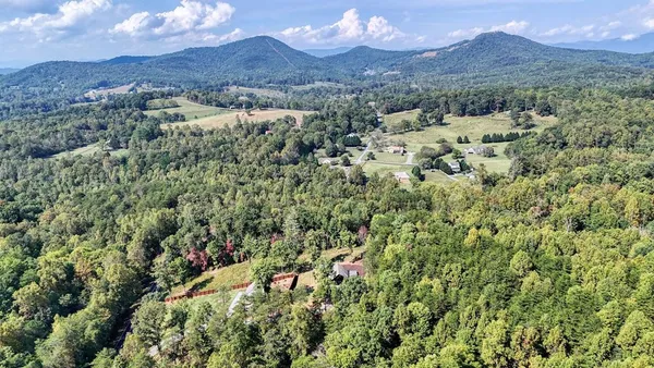 a view of a town with mountains in the background