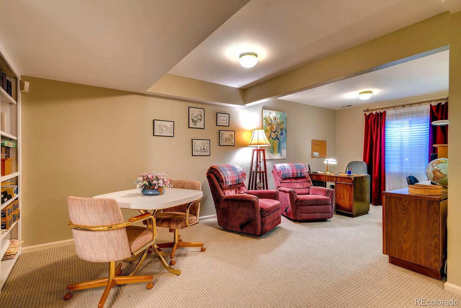 6207 Trailhead Road Highlands Ranch, CO 80130 - Photo 23 of 28 a view of a livingroom with furniture and a couch