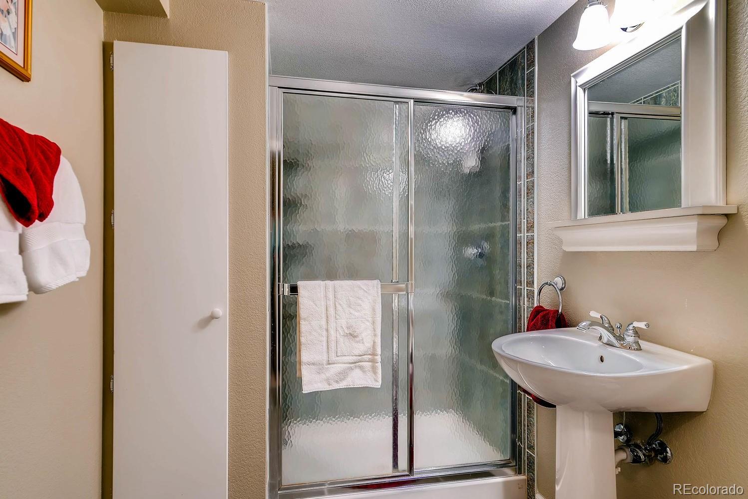 6207 Trailhead Road Highlands Ranch, CO 80130 - Photo 25 of 28 a bathroom with a sink and mirror