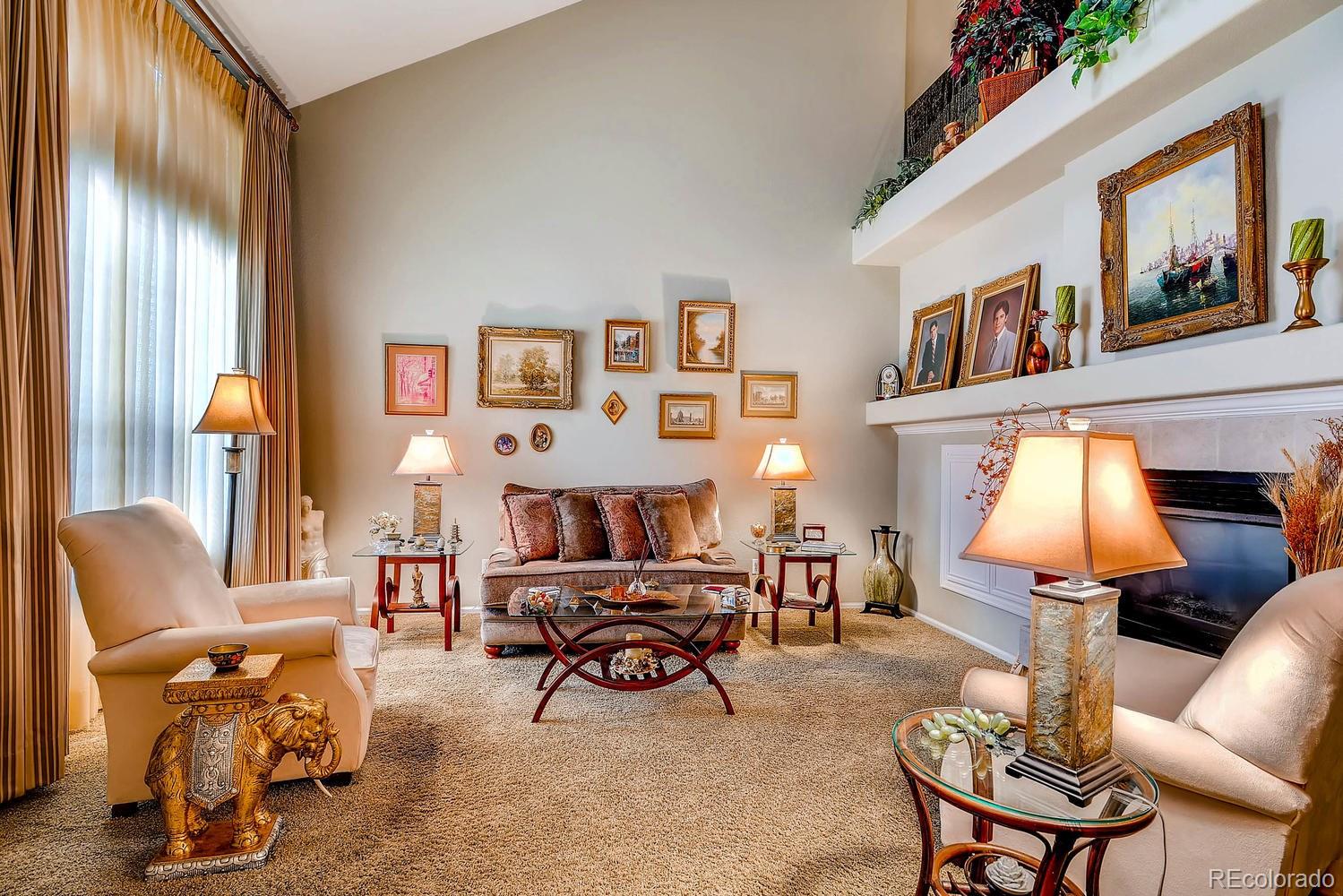 6207 Trailhead Road Highlands Ranch, CO 80130 - Photo 4 of 28 a living room with furniture and a lamp