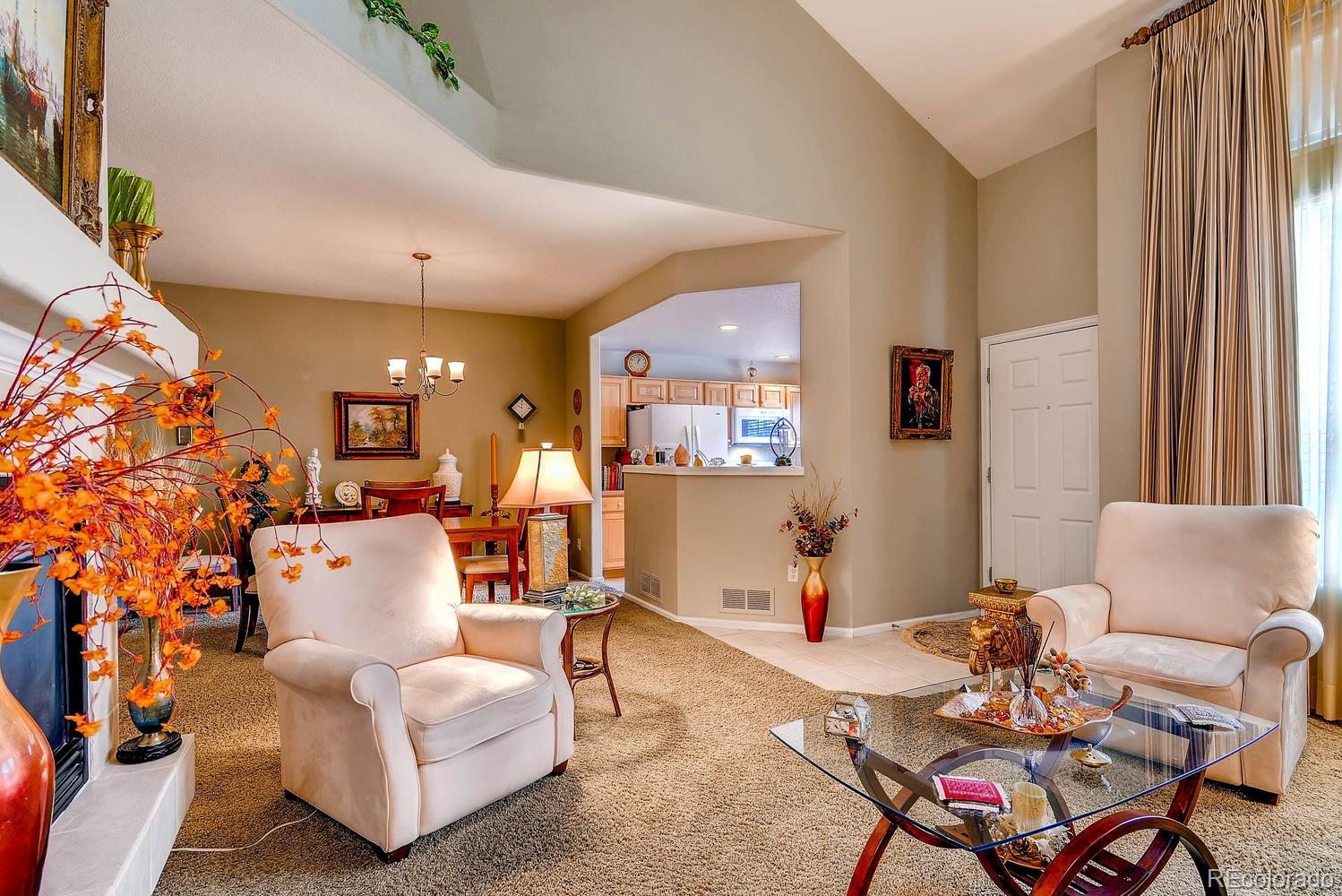 6207 Trailhead Road Highlands Ranch, CO 80130 - Photo 6 of 28 a living room with furniture and a large window