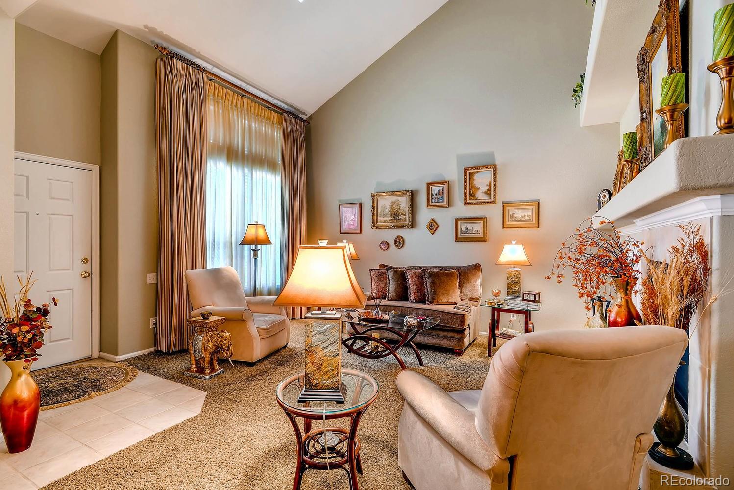 6207 Trailhead Road Highlands Ranch, CO 80130 - Photo 7 of 28 a living room with furniture and a large window