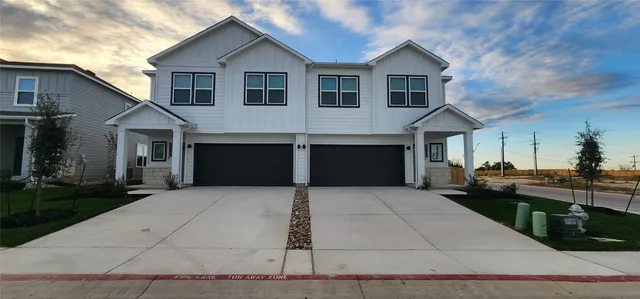 a front view of a house with yard
