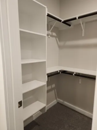 a view of an empty walk in closet