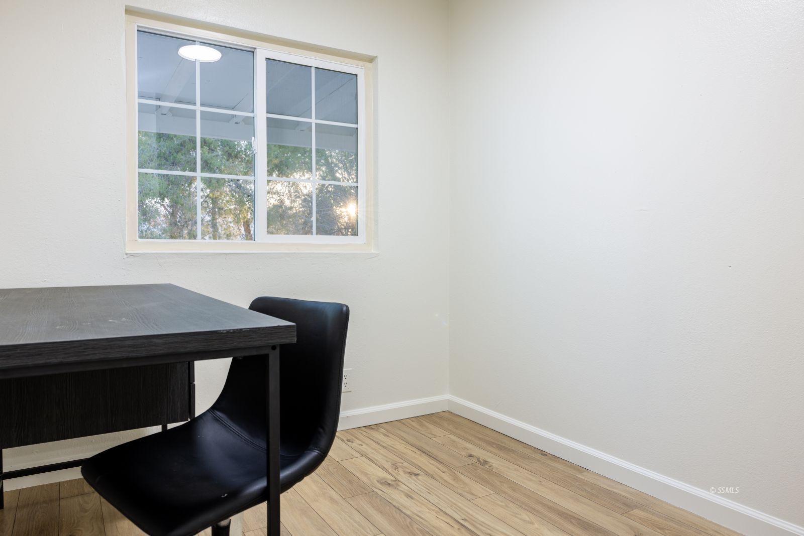 828 North Victor Street Ridgecrest, CA 93555 - Photo 21 of 50 a living room with a chair and a window