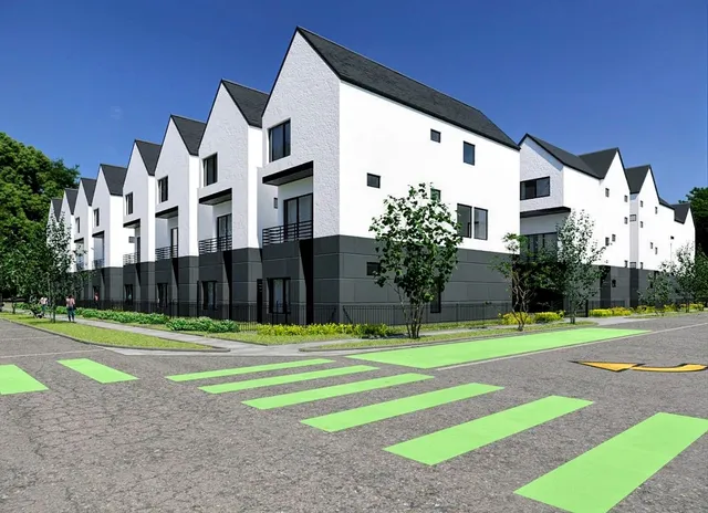 an aerial view of residential houses with outdoor space