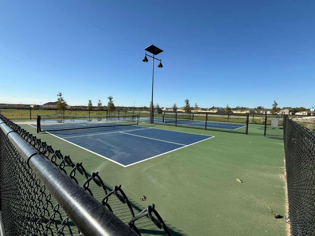 106 Brabham Loop Hutto, TX 78634 - Photo 38 of 40 Outdoor recreational courts featuring a blue playing surface and green surrounds