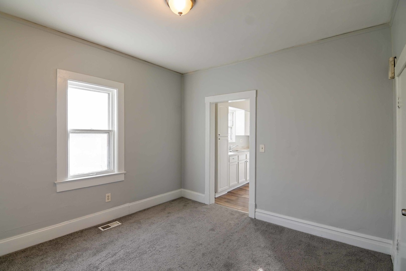 817 11th Street North Chicago, IL 60064 - Photo 13 of 45 an empty room with windows