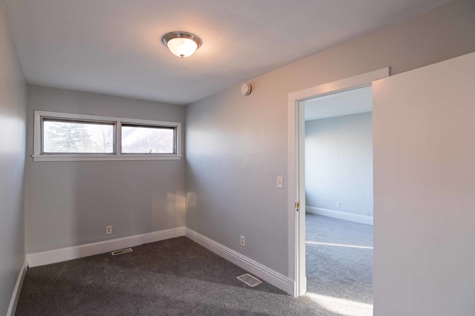 817 11th Street North Chicago, IL 60064 - Photo 16 of 45 an empty room that has a window
