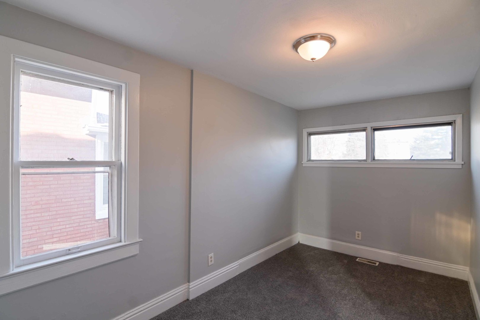 817 11th Street North Chicago, IL 60064 - Photo 17 of 45 an empty room with windows