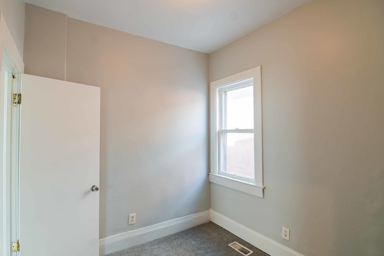 817 11th Street North Chicago, IL 60064 - Photo 21 of 45 a view of an empty room with a window
