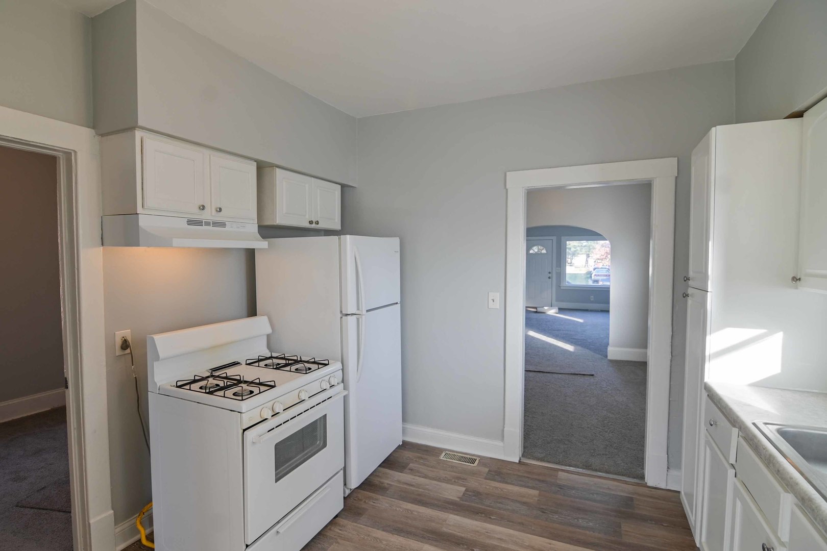 817 11th Street North Chicago, IL 60064 - Photo 27 of 45 a kitchen with a stove and a refrigerator