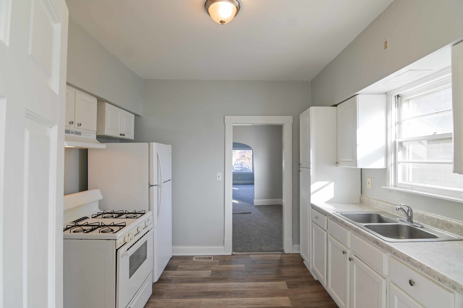817 11th Street North Chicago, IL 60064 - Photo 28 of 45 a kitchen with a sink and a stove top oven