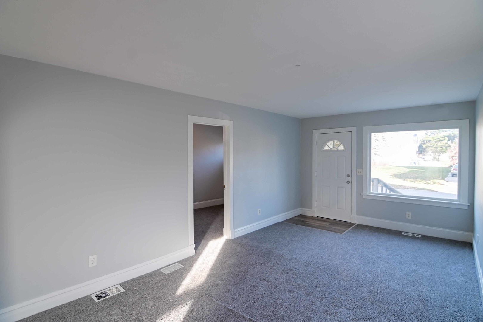 817 11th Street North Chicago, IL 60064 - Photo 5 of 45 an empty room with windows