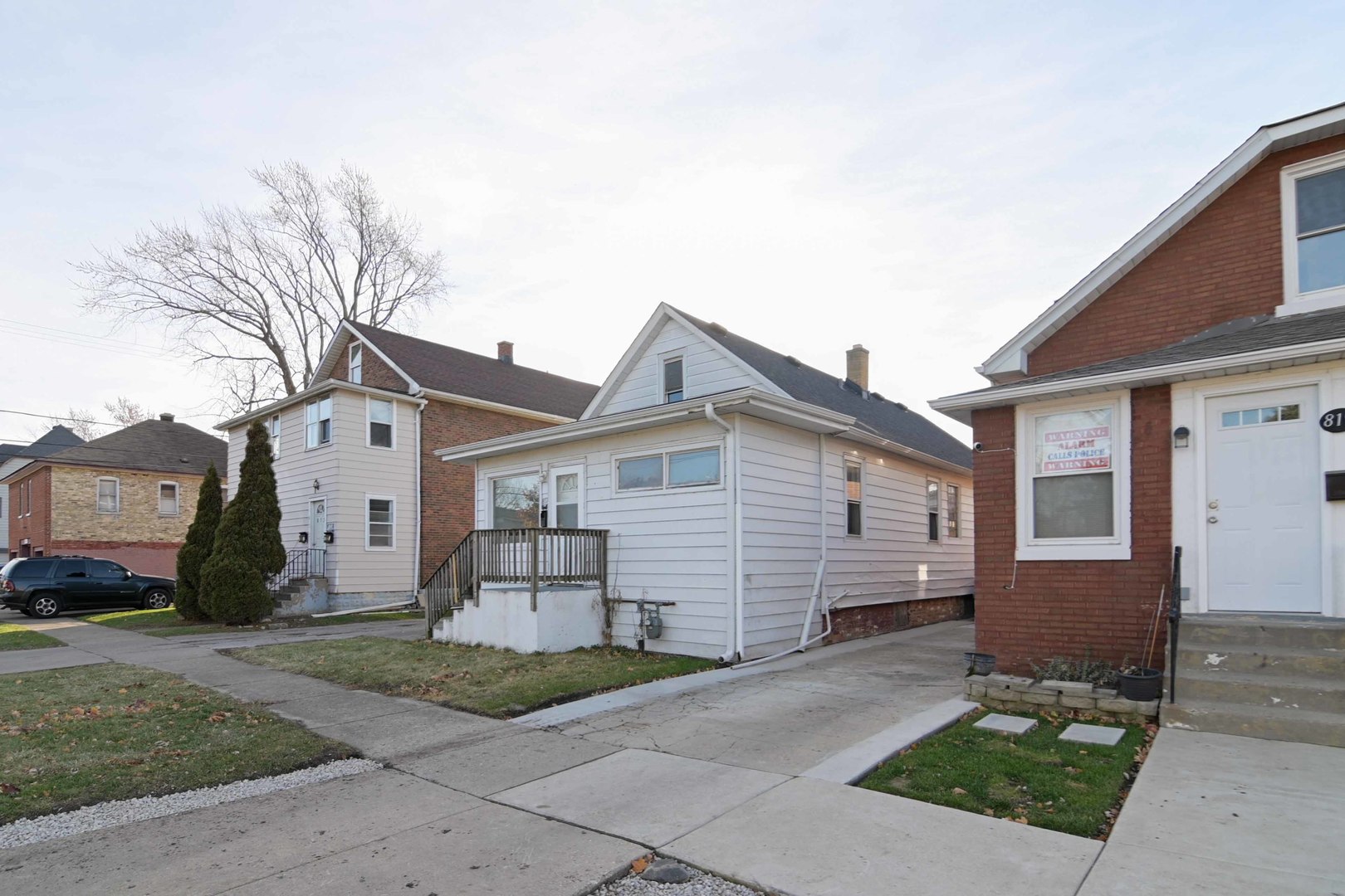 817 11th Street North Chicago, IL 60064 - Photo 43 of 45 a front view of a house with a yard and garage