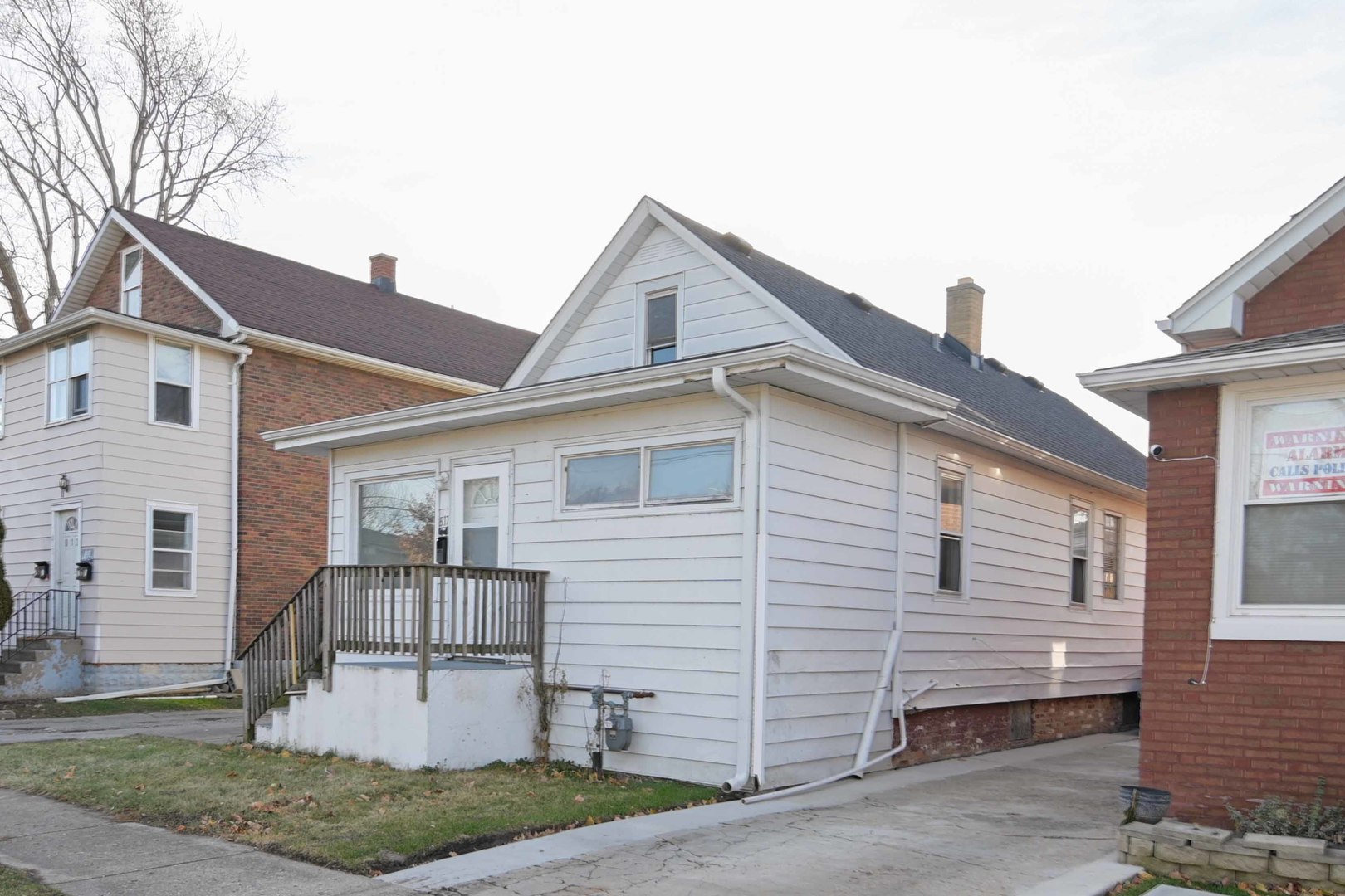 817 11th Street North Chicago, IL 60064 - Photo 44 of 45 a front view of a house with a yard and garage