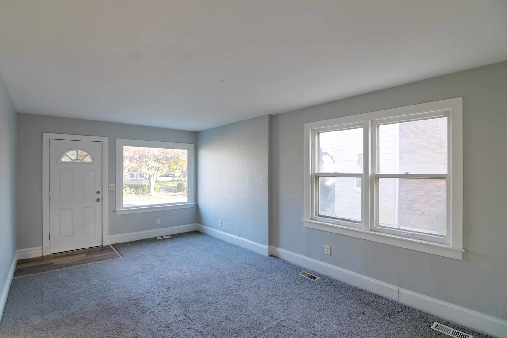 817 11th Street North Chicago, IL 60064 - Photo 7 of 45 an empty room with windows