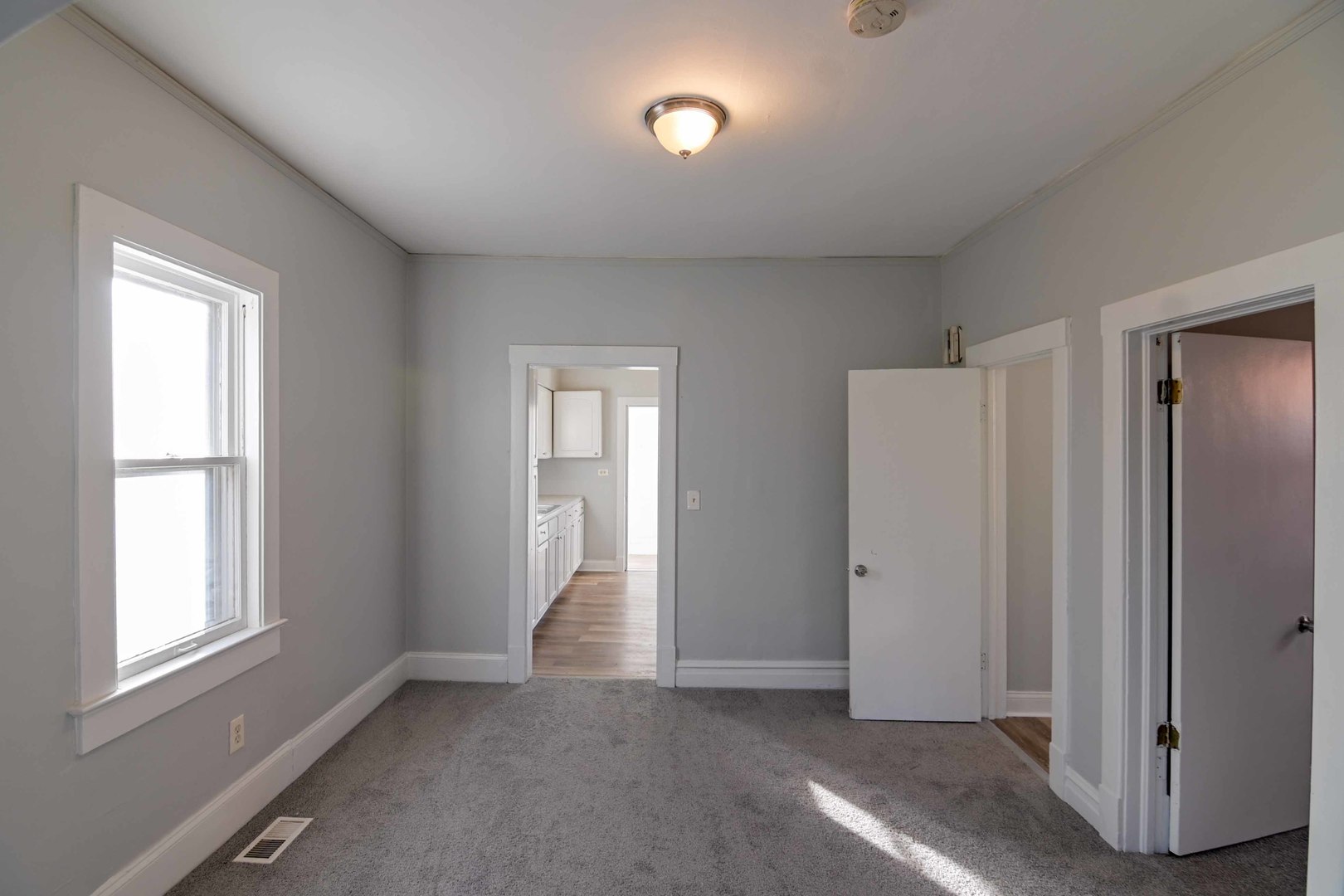 817 11th Street North Chicago, IL 60064 - Photo 8 of 45 a view of an empty room with a window