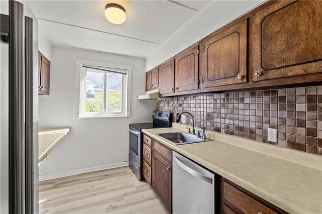 a kitchen with a sink and cabinets