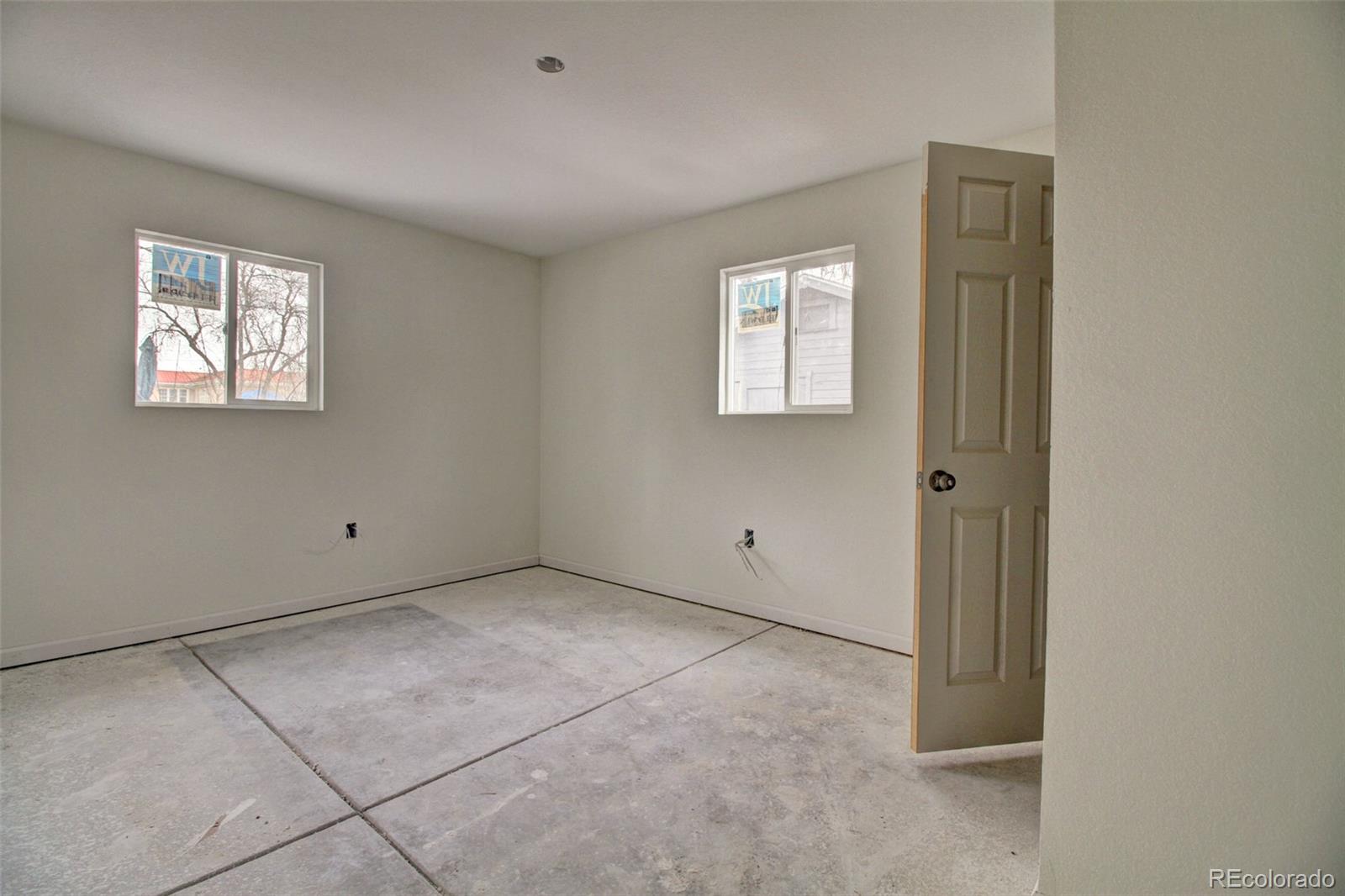 10 South Irving Street Denver, CO 80219 - Photo 3 of 10 a view of an empty room with a window