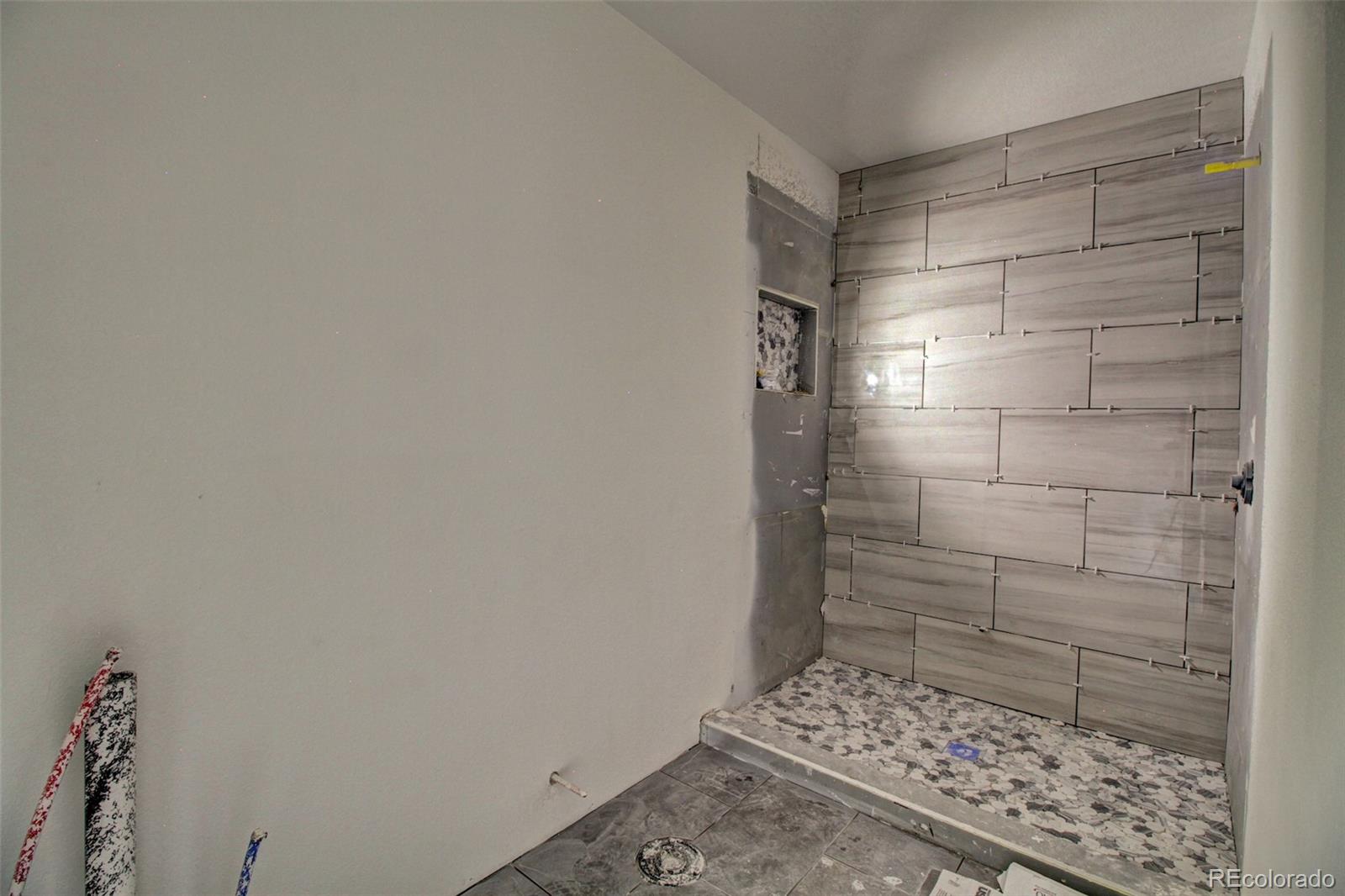 10 South Irving Street Denver, CO 80219 - Photo 4 of 10 a bathroom with a shower