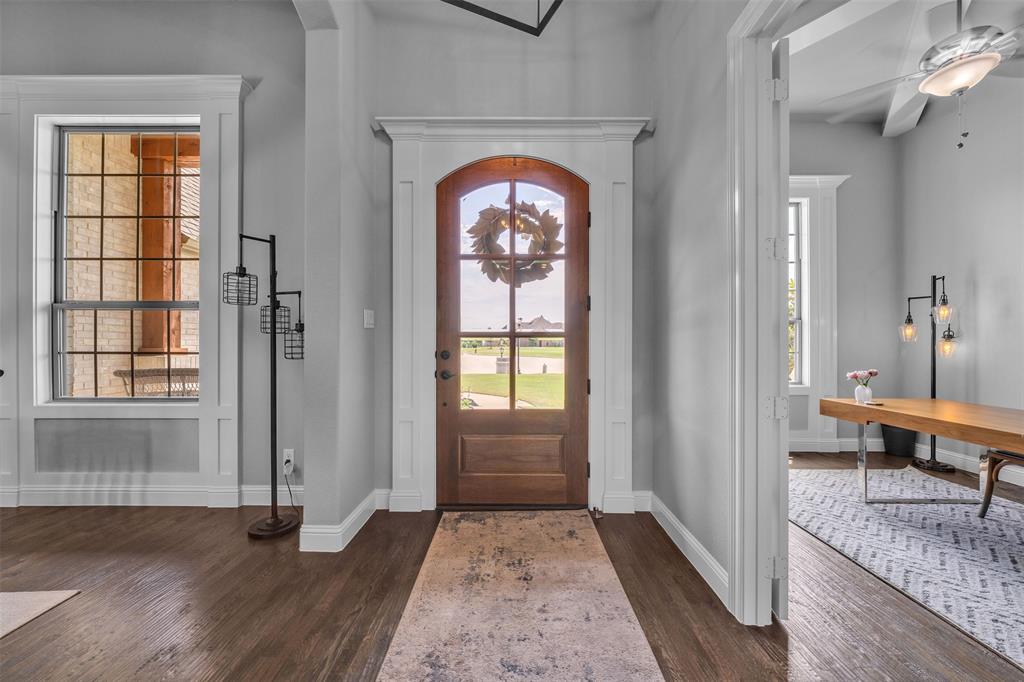 1060 Waters Edge Court Oak Point, TX 75068 - Photo 4 of 40 a view of front door with wooden floor and a window