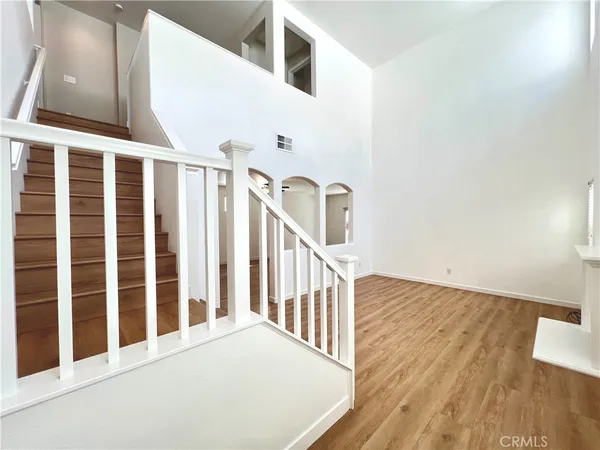 a view of an entryway with wooden floor