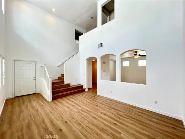 a view of entryway with wooden floor
