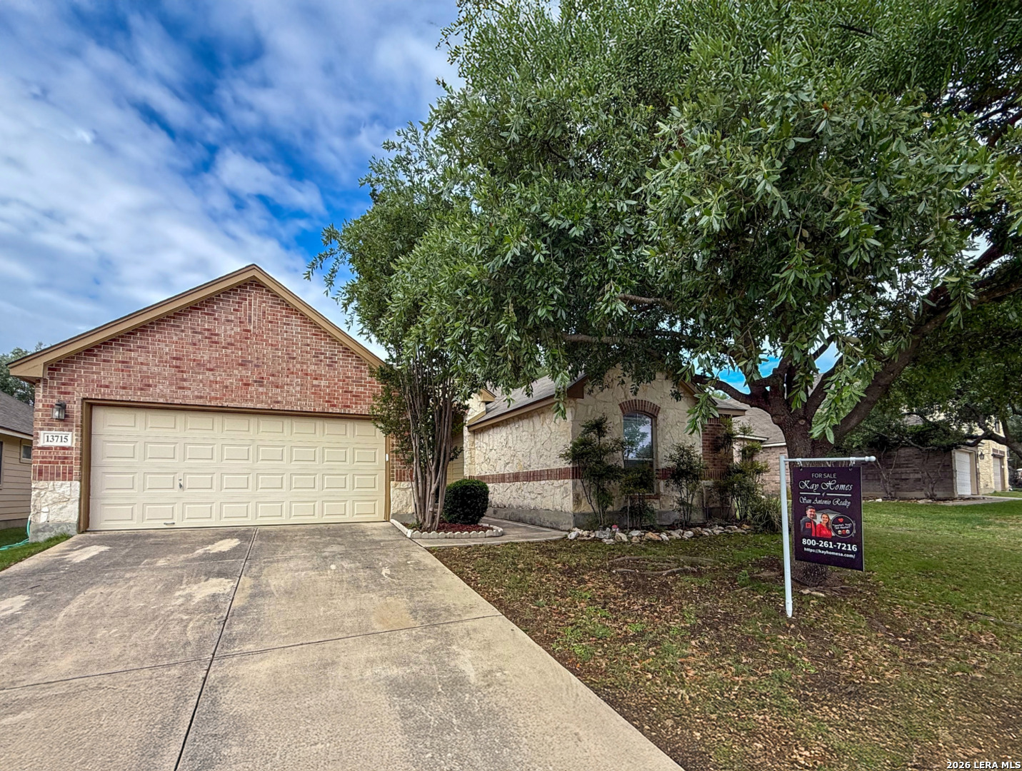 13715 Jubilee Way Helotes, TX 78023 - Photo 2 of 34 a front view of a house with garden
