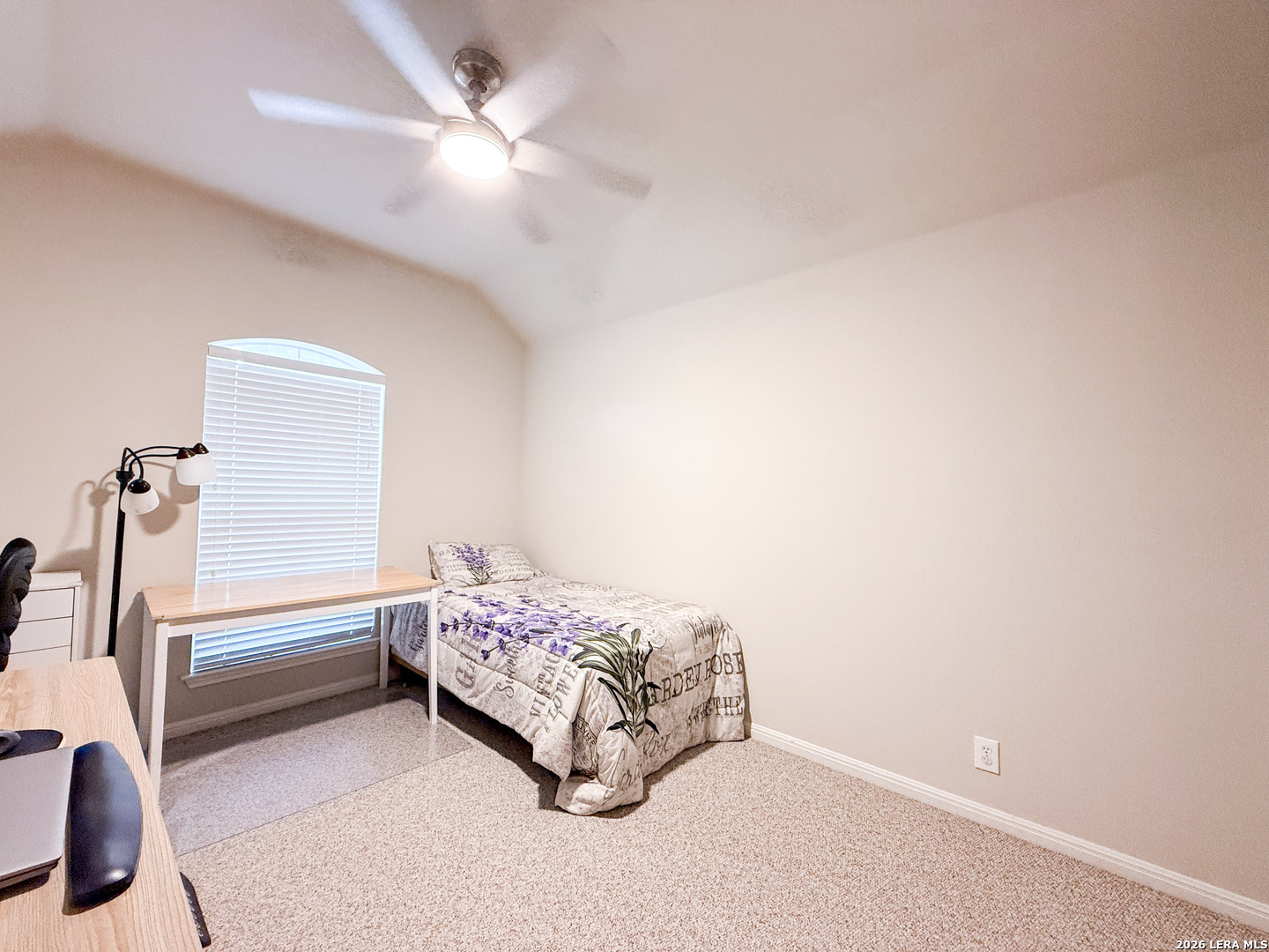 13715 Jubilee Way Helotes, TX 78023 - Photo 25 of 34 a bedroom with a bed and a ceiling fan