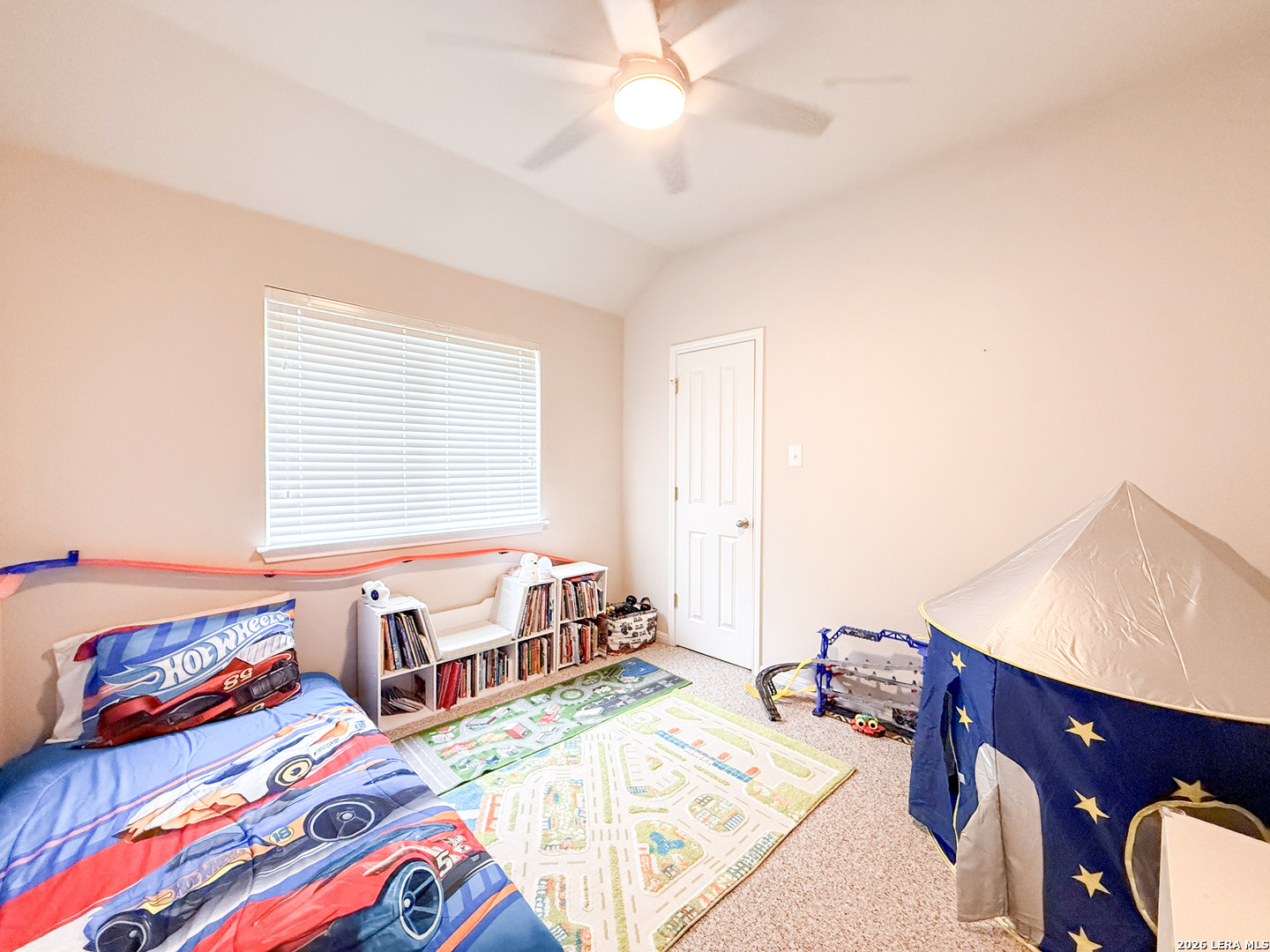 13715 Jubilee Way Helotes, TX 78023 - Photo 27 of 34 a bedroom with two beds and a dresser