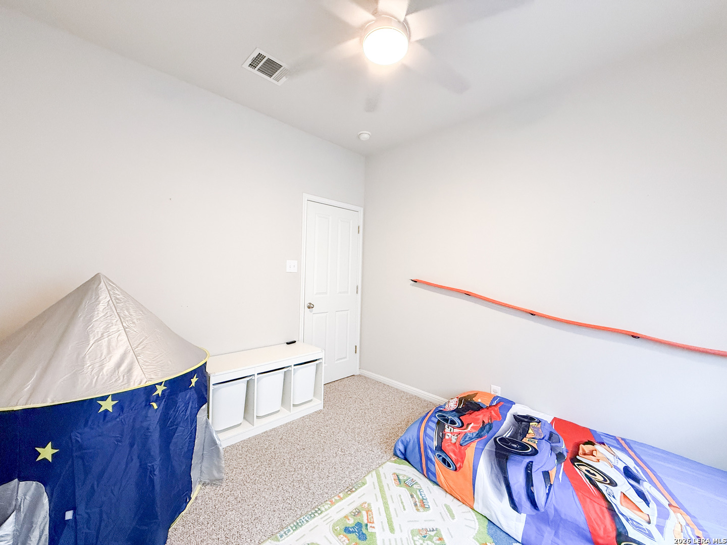 13715 Jubilee Way Helotes, TX 78023 - Photo 28 of 34 a bedroom with a bed and a dresser
