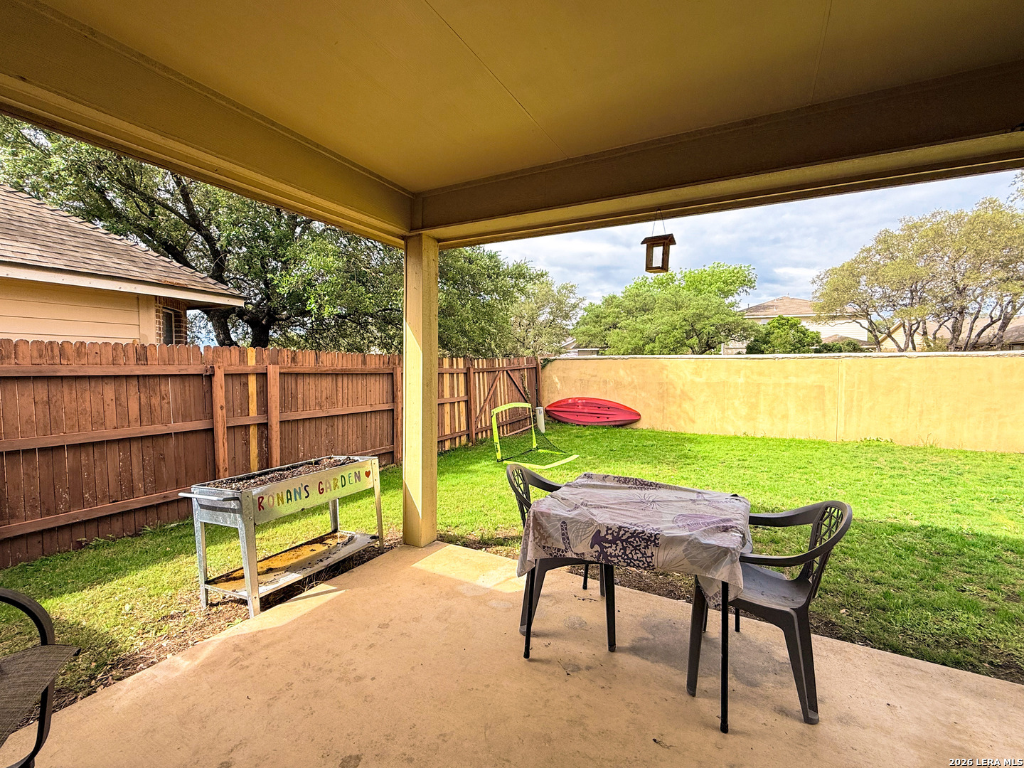 13715 Jubilee Way Helotes, TX 78023 - Photo 29 of 34 a view of a chairs with a table in a patio