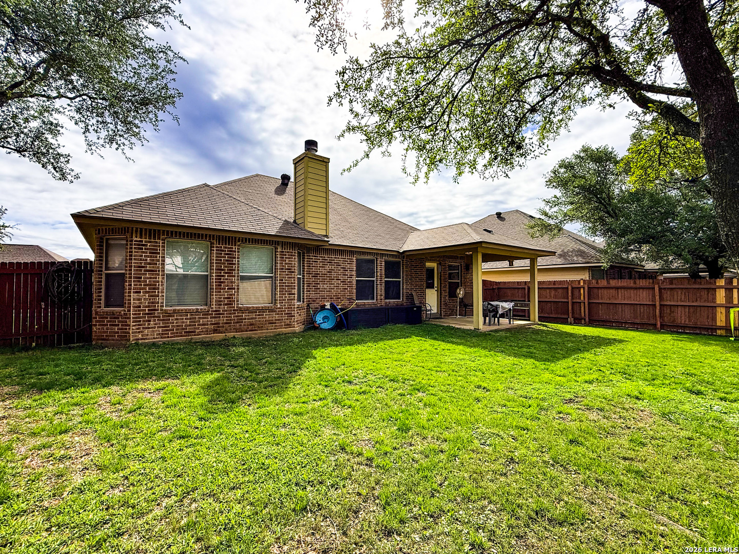 13715 Jubilee Way Helotes, TX 78023 - Photo 33 of 34 a front view of a house with garden