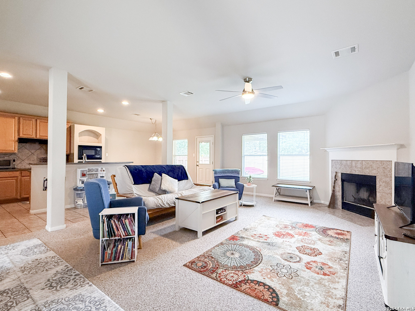 13715 Jubilee Way Helotes, TX 78023 - Photo 4 of 34 a living room with furniture or fireplace and a table