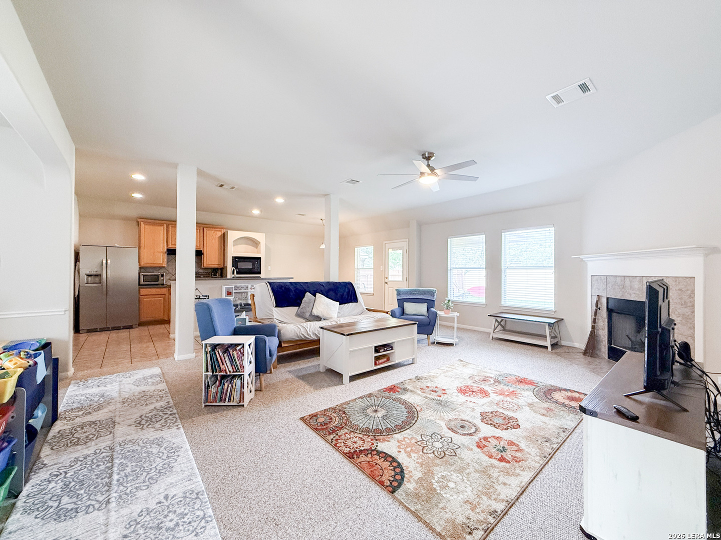 13715 Jubilee Way Helotes, TX 78023 - Photo 6 of 34 a living room with furniture rug and a table