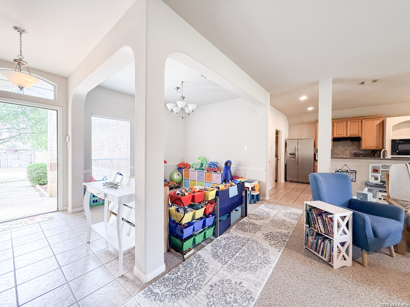 13715 Jubilee Way Helotes, TX 78023 - Photo 7 of 34 a living room with furniture and a open kitchen view