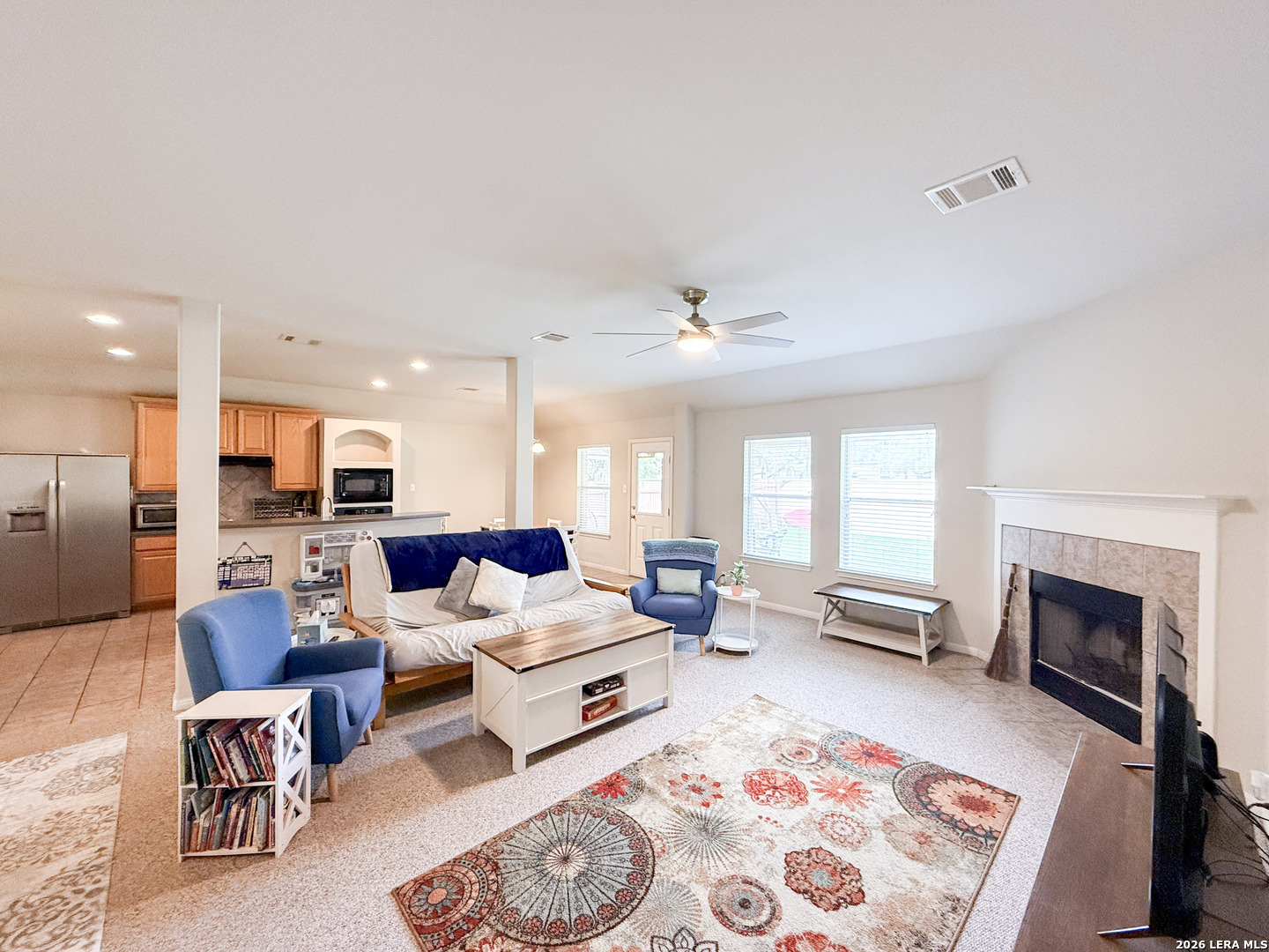 13715 Jubilee Way Helotes, TX 78023 - Photo 9 of 34 a living room with furniture and a fireplace