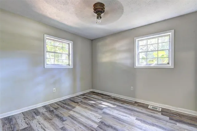 a view of a livingroom with wooden floor
