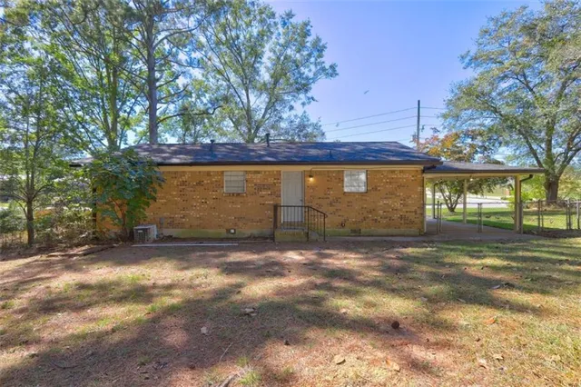 a view of a yard with large trees