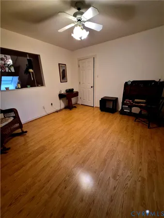 a bedroom with a bed window and dresser