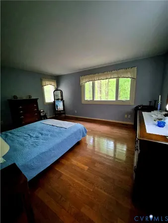 a spacious bathroom with a double vanity sink and mirror